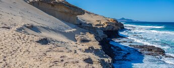 der Westcoast Trail mit der Silhouette des Jandía-Gebirges im Hintergrund