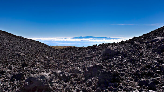Lavafelder des Vulkans Fasnia mit der Nachbarinsel Gran Canaria im Hintergrund | © Sunhikes Lavafelder des Vulkans Fasnia mit Gran Canaria im Hintergrund | © Sunhikes